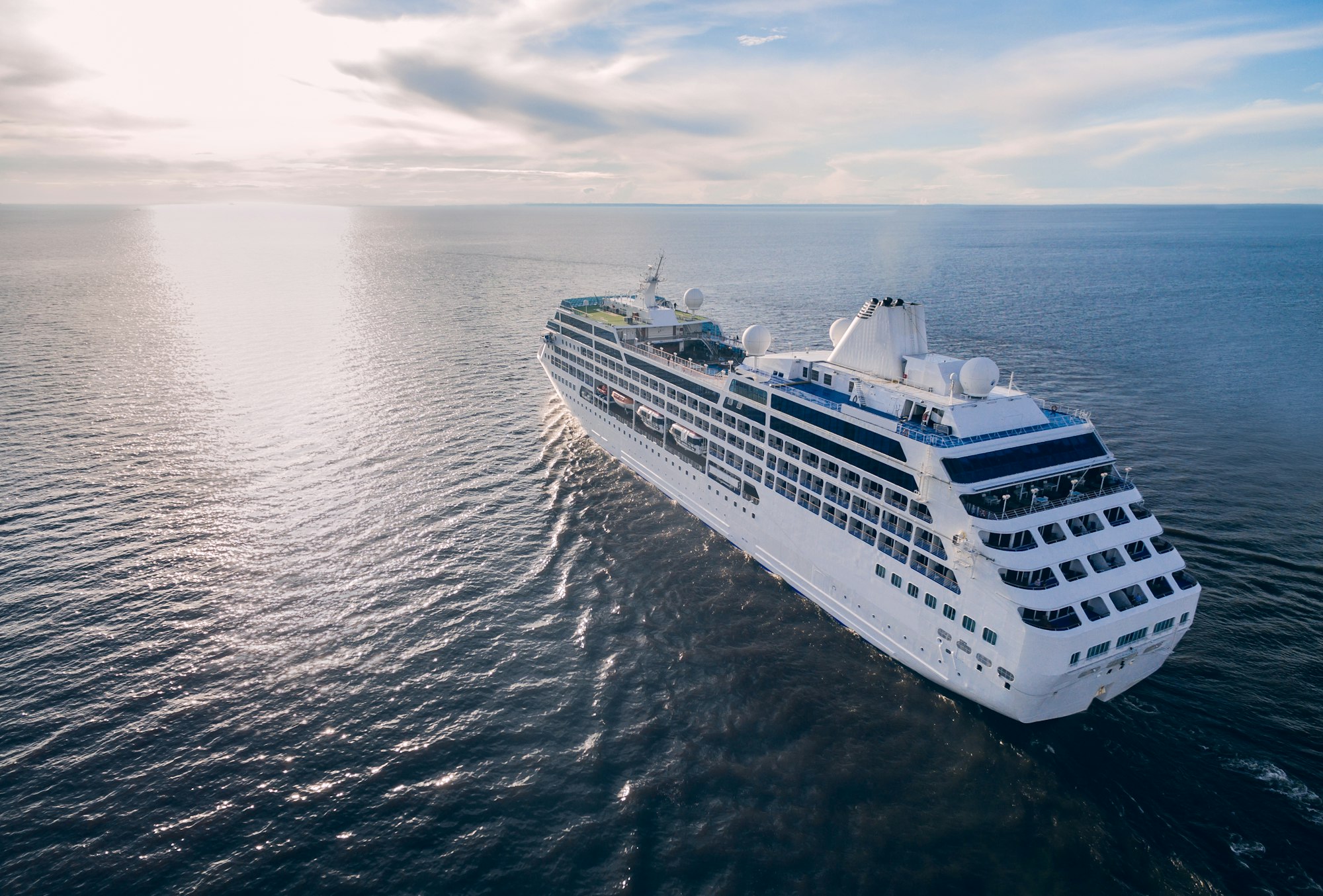 Aerial view of cruise liner sailing in the open sea